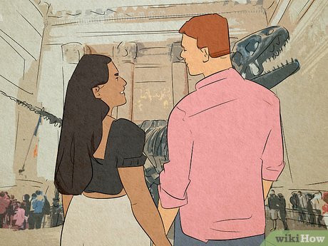 A man and a woman holding hands in front of a dinosaur skeleton at a museum.