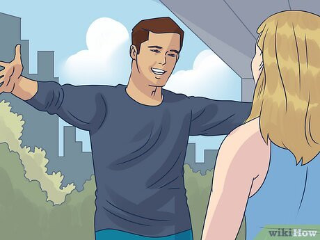 Step 3 Open your arms and step toward her to signal that you want to hug her.
